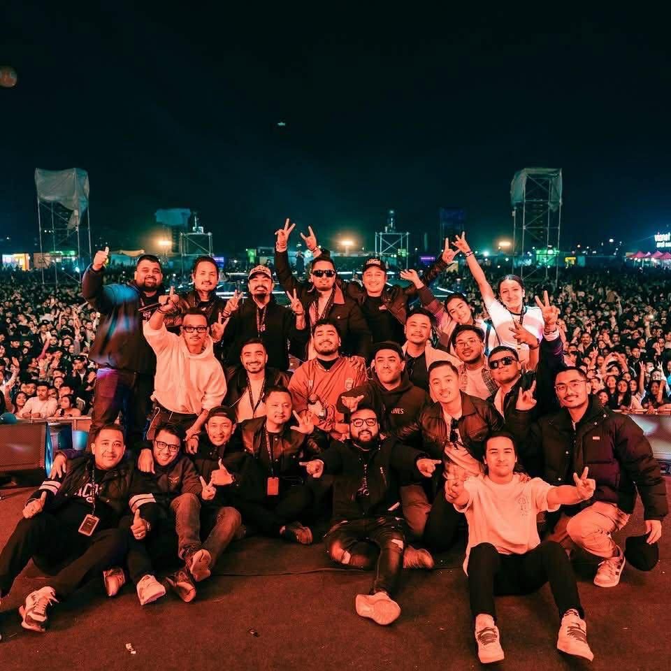 Production crew and artist party on site at night